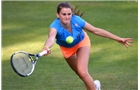 BIRMINGHAM, ENGLAND - JUNE 09:  Katy Dunne of Great Britain returns a shot from Camila Giorgi of Italy on day one of the AEGON Classic Tennis Tournament at Edgbaston Priory Club on June 9, 2014 in Birmingham, England.  (Photo by Tom Dulat/Getty Images)